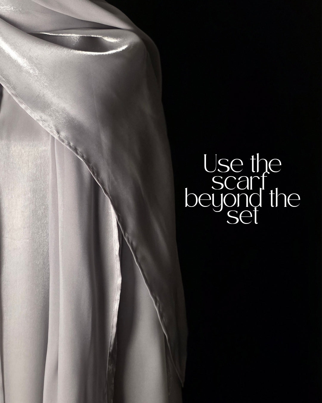 Silver scarf draped over a black background with text 'Use the scarf beyond the set'.